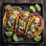Sheet Pan Fish Tacos: Quick, Flavorful, and Perfect for Busy Nights 6 Sheet pan fish tacos with roasted vegetables and lime crema